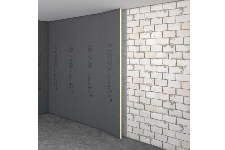 Coin de pièce avec panneaux de construction Swissspor Board au mur