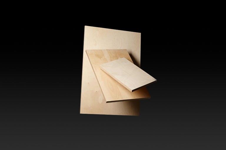 Trois panneaux de bois clair de différentes tailles