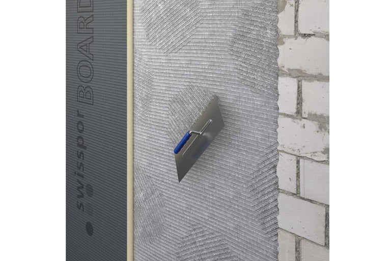 Panneau Swissopor avec enduit de lissage sur un mur