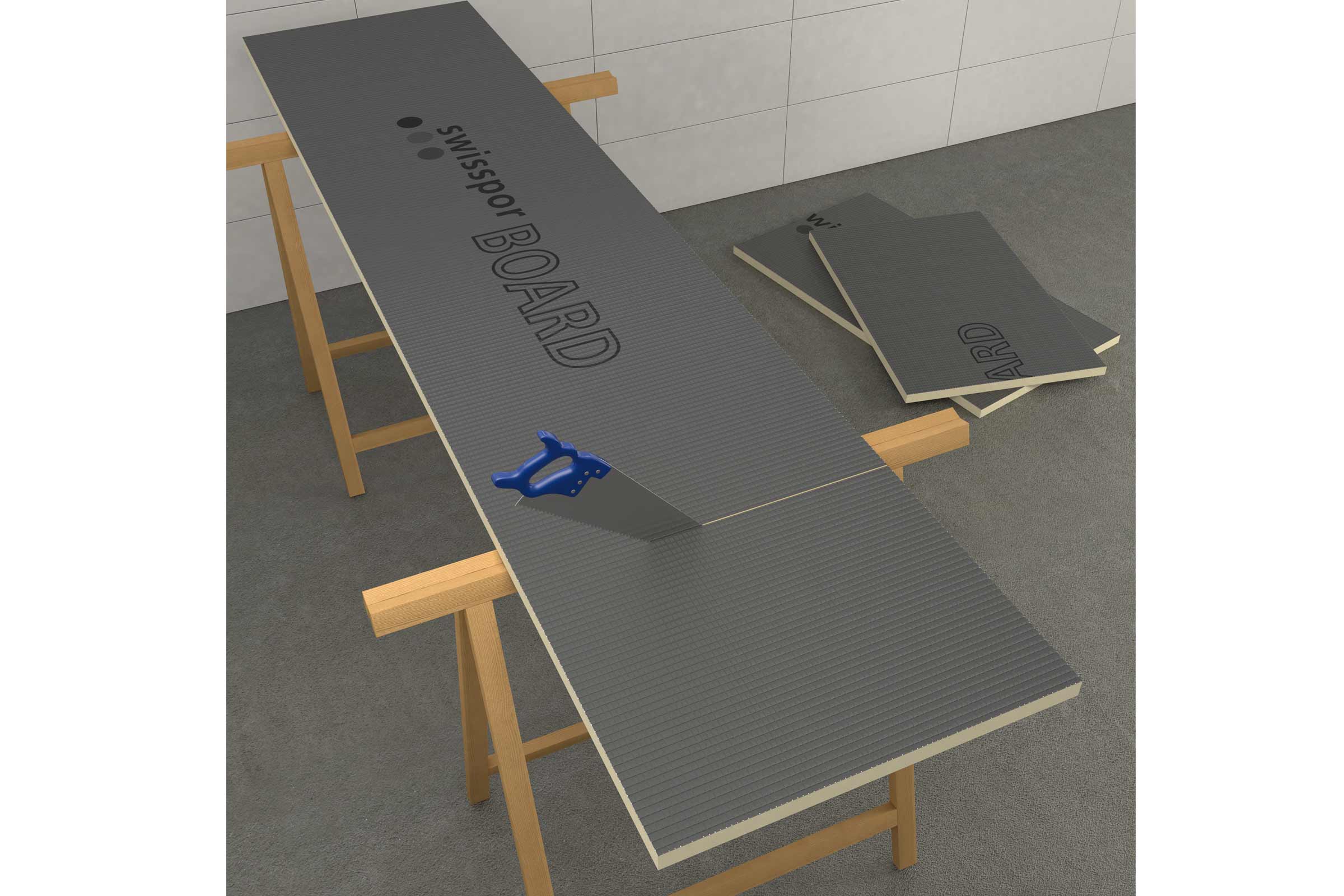 Szene mit Hartschaumplatten auf Holzböcken und Handsäge