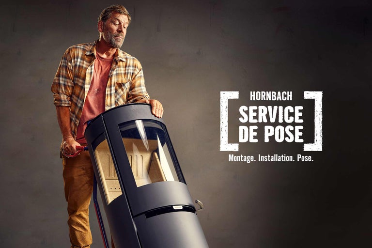 Homme transportant un poêle ; Service de pose Hornbach