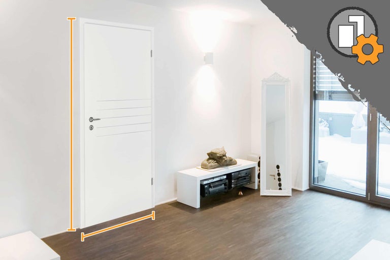 Intérieur avec porte intérieure blanche et indications de dimensions