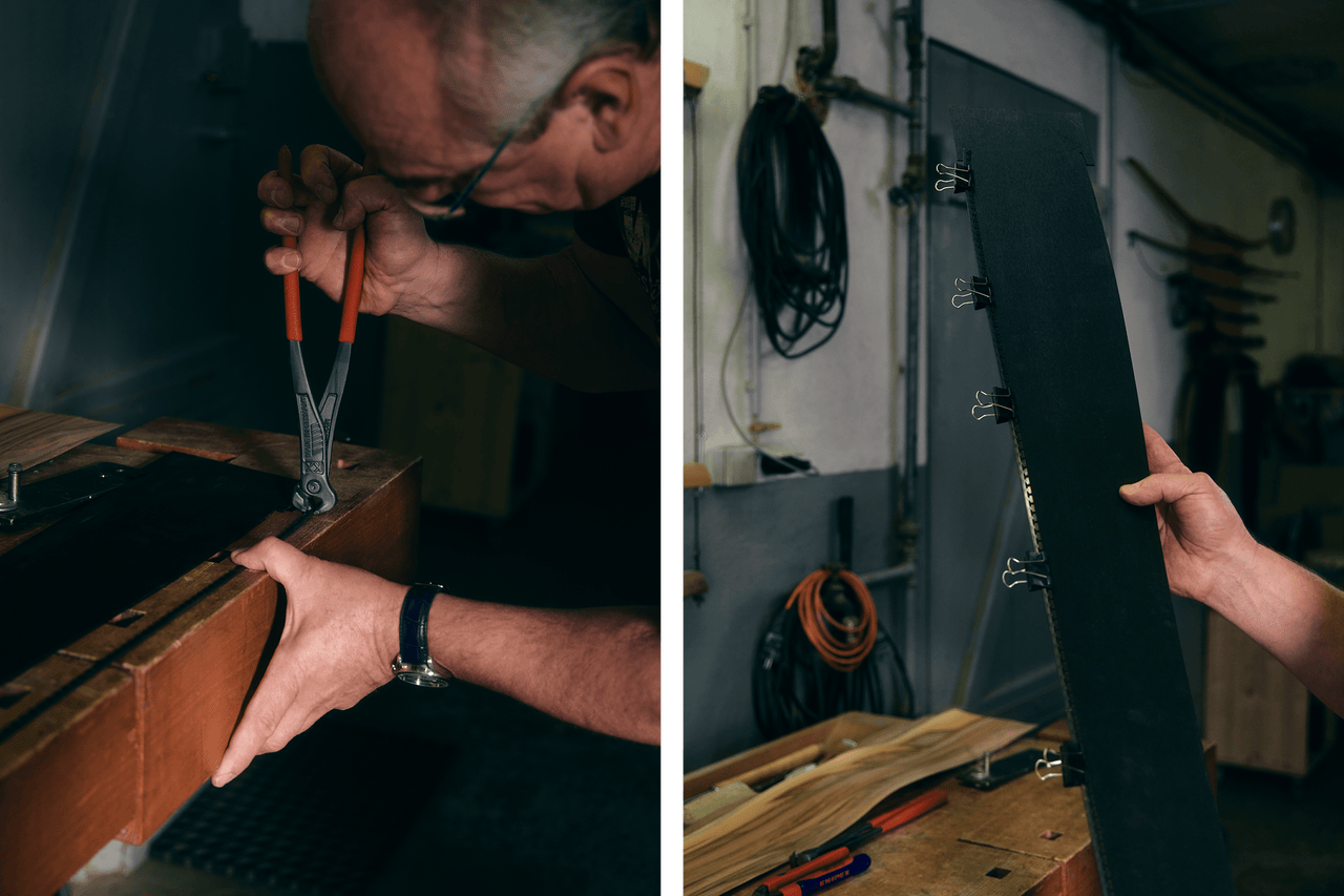 Werkstattsituation mit Handwerker bei der Bearbeitung eines Werkstücks mit einer Zange.