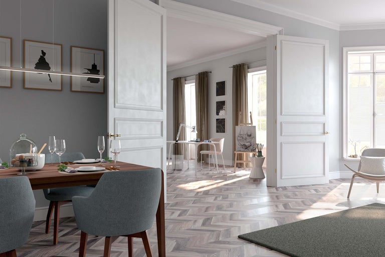 Vue d'intérieur avec table à manger, chaises et porte blanche ouverte