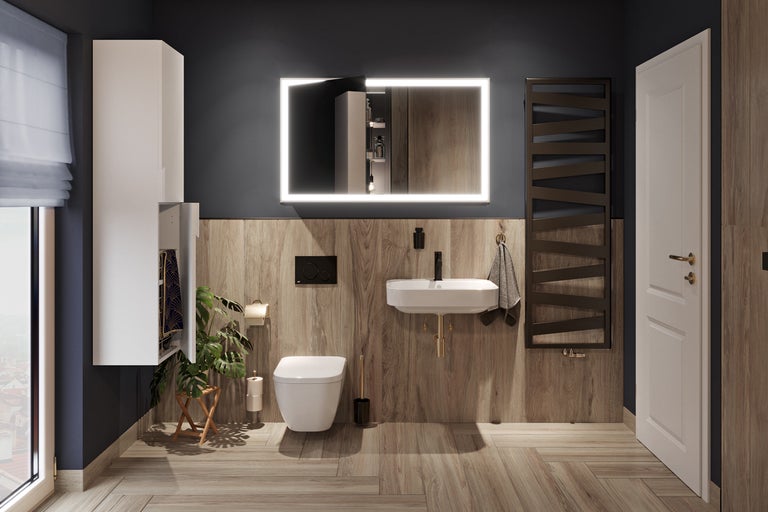 Salle de bains moderne avec lavabo, miroir avec éclairage, radiateur sèche-serviettes et meubles assortis.