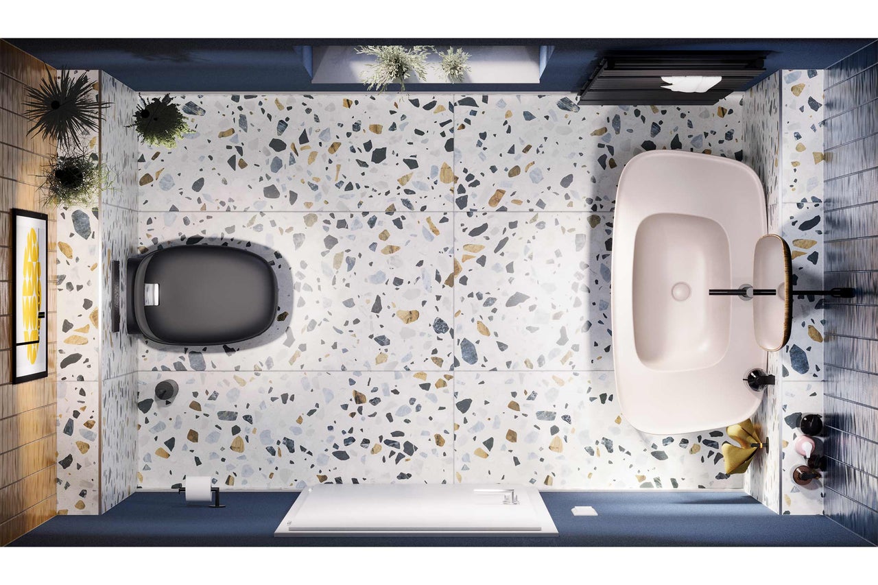 Salle de bains avec toilettes, baignoire et sol en terrazzo en vue plongeante