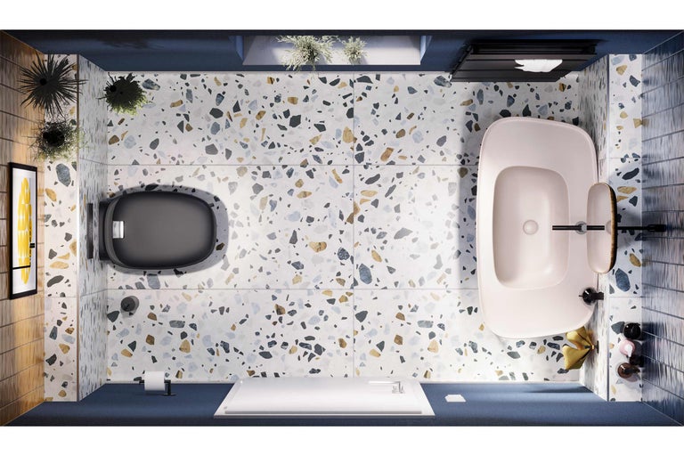 Salle de bains avec toilettes, baignoire et sol en terrazzo en vue plongeante