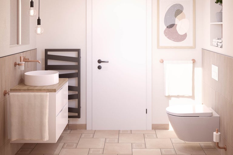 Salle de bain lumineuse avec lavabo, sèche-serviettes et WC suspendu pour une ambiance conviviale.