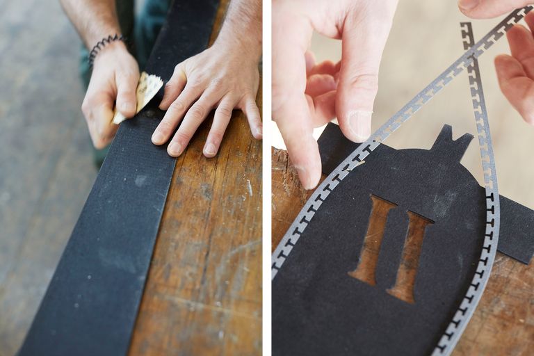 Sur l'image, une pièce est travaillée avec du papier de verre et un pochoir avec la lettre I est retiré.