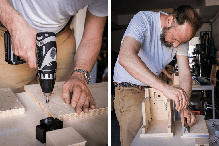Artisan travaillant sur un projet en bois avec une visseuse sans fil.