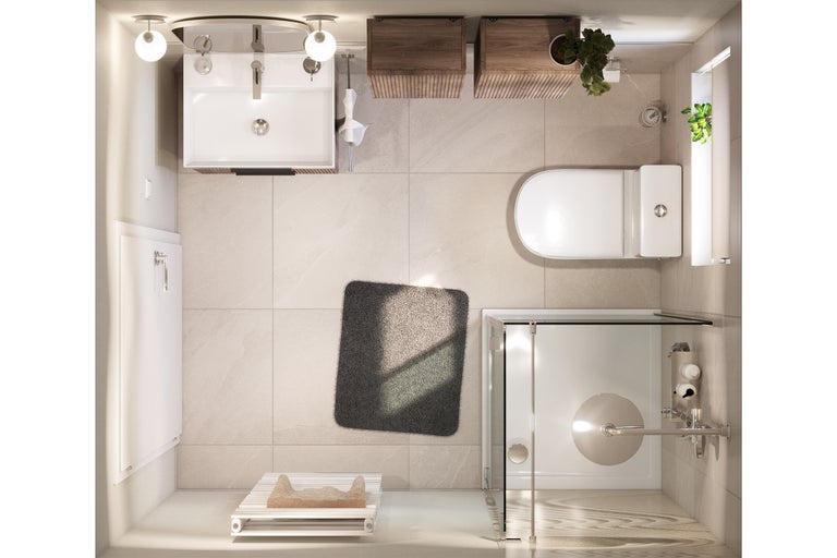 Vue aérienne d’une salle de bains avec lavabo, toilettes, douche et tapis de bain