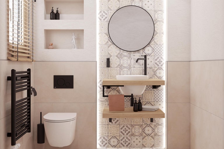 Salle de bain lumineuse avec toilettes, lavabo, miroir et radiateur