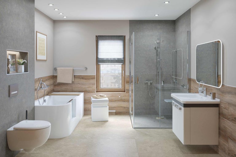Salle de bain lumineuse avec baignoire, douche, lavabo et toilettes au design moderne