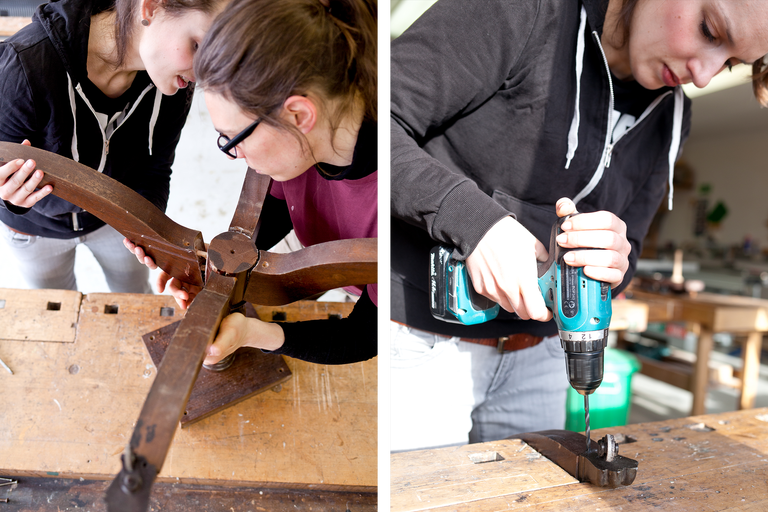 Zwei Frauen reparieren einen hölzernen Tischfuß mit einer Bohrmaschine.
