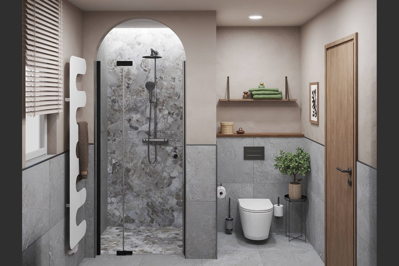 Modernes Badezimmer mit Rundbogendusche, Wand-WC, weissem Designheizkörper und grossformatigen Fliesen in Steinoptik.