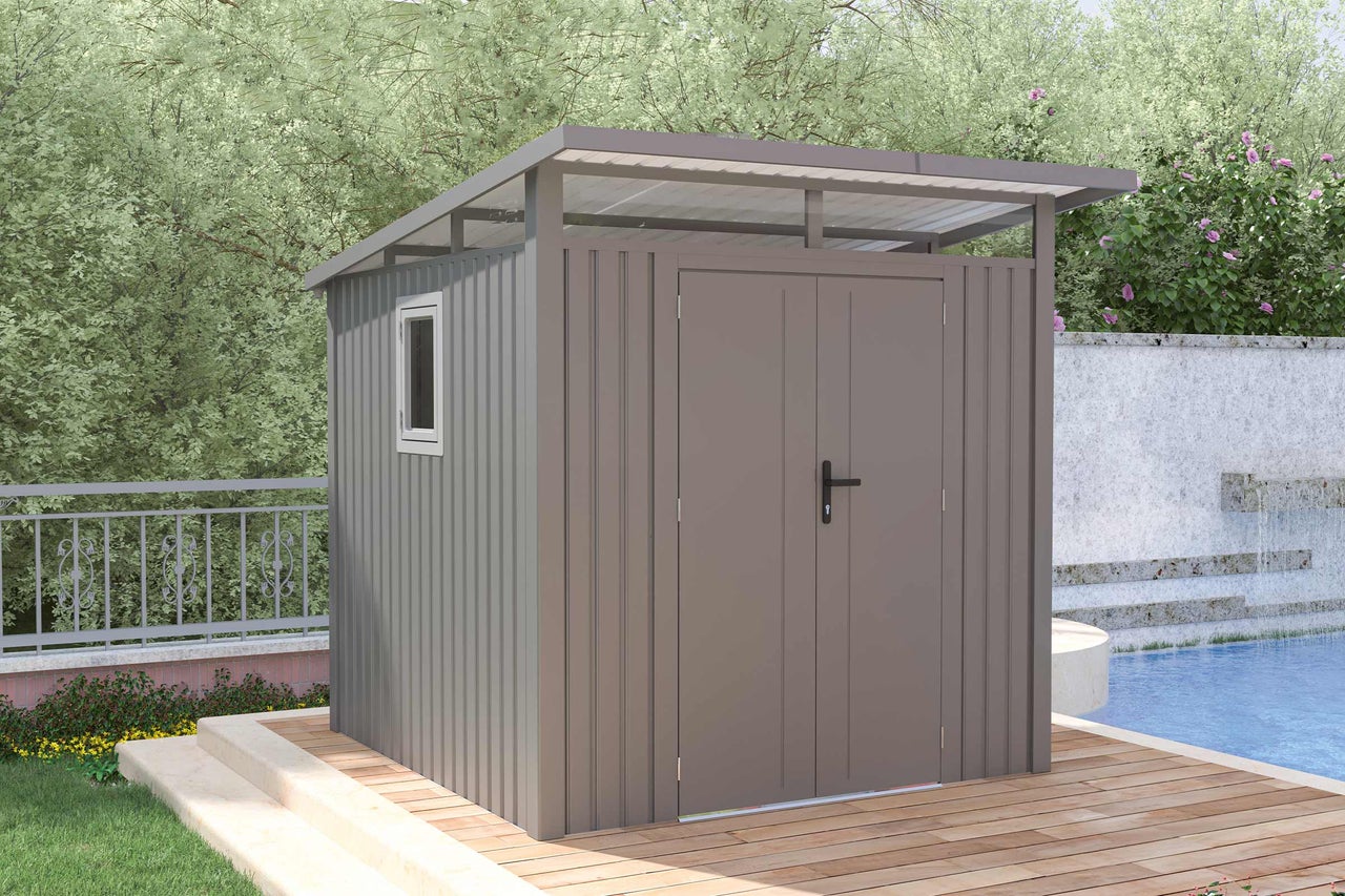 Abri de jardin en métal avec fenêtre et double porte dans le jardin