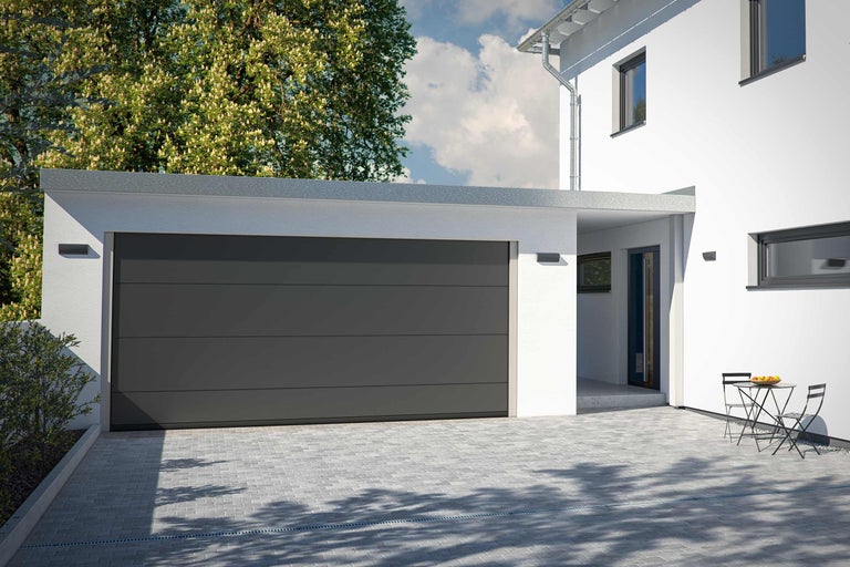 Modernes Einfamilienhaus mit Garage und gepflasterter Einfahrt