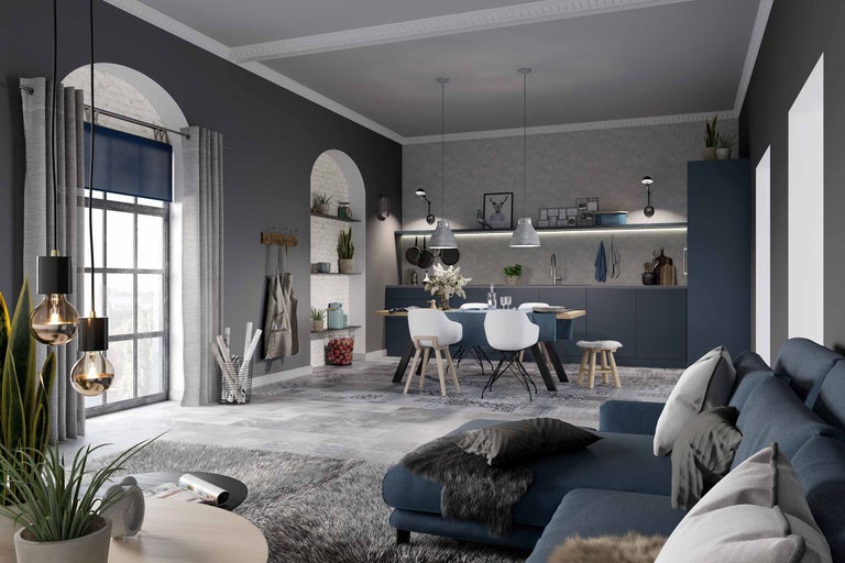 Helles Wohnzimmer mit Sofa, Esstisch und Küchenzeile