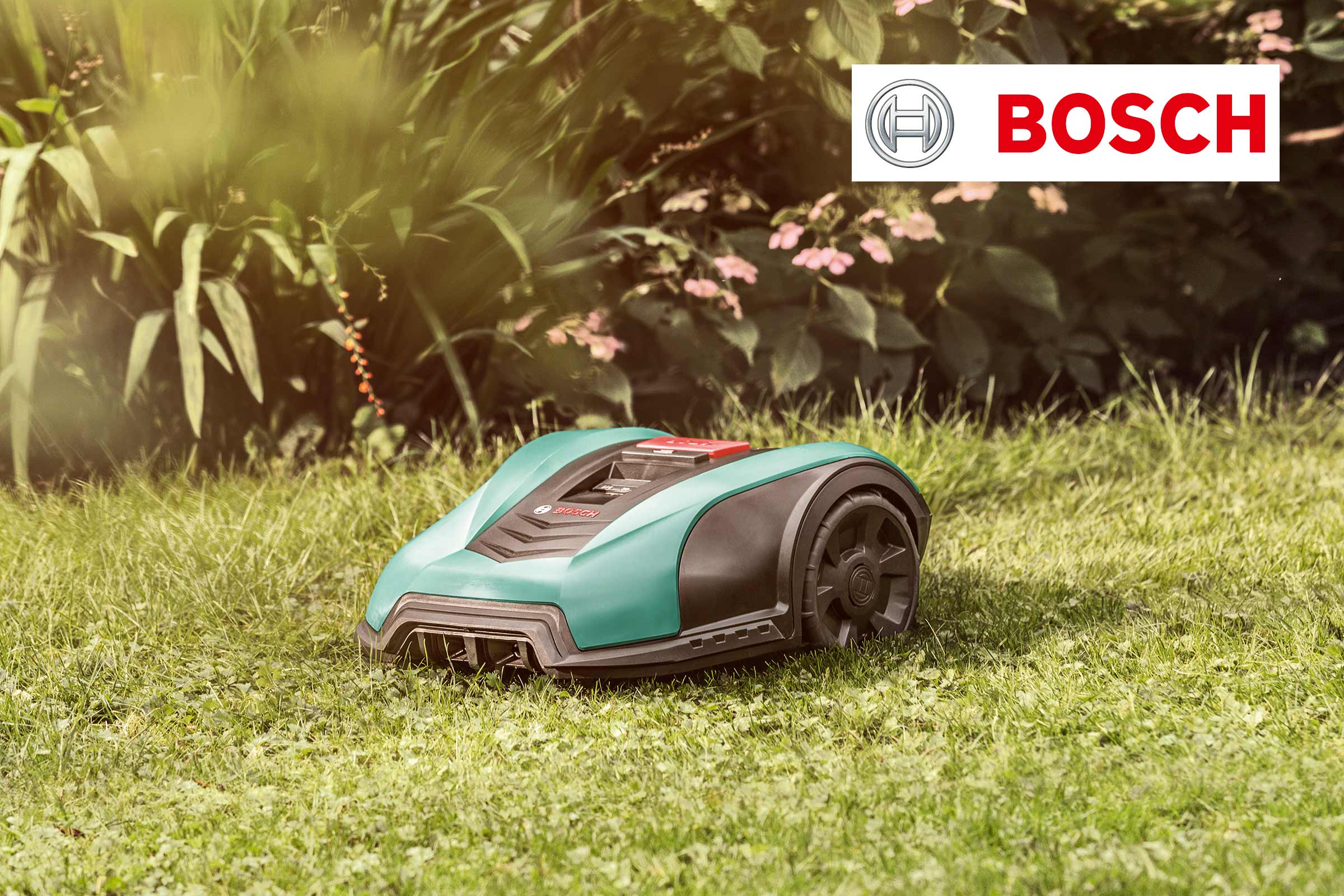 Logo Bosch avec robot tondeuse sur pelouse