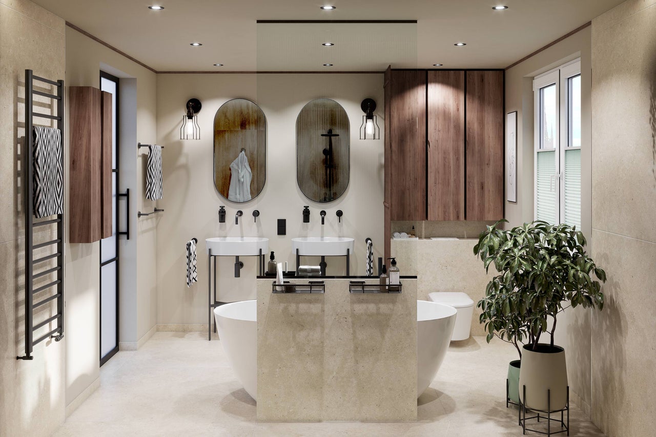 Salle de bains moderne avec double lavabo, miroirs ovales, baignoire en îlot, meubles en bois et radiateur sèche-serviettes.