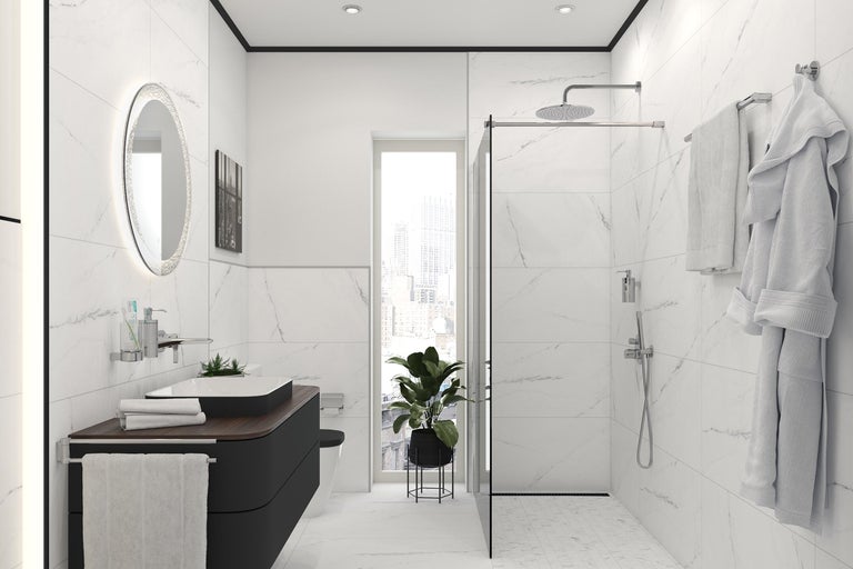 Salle de bain lumineuse avec douche, lavabo et miroir