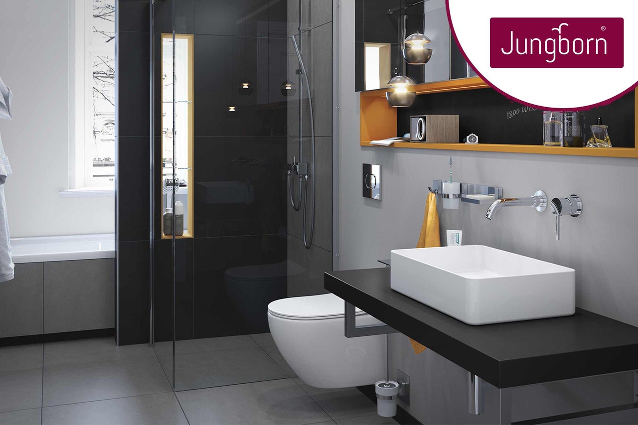 Modernes Badezimmer mit Dusche, Toilette und Waschbecken sowie Jungborn Logo