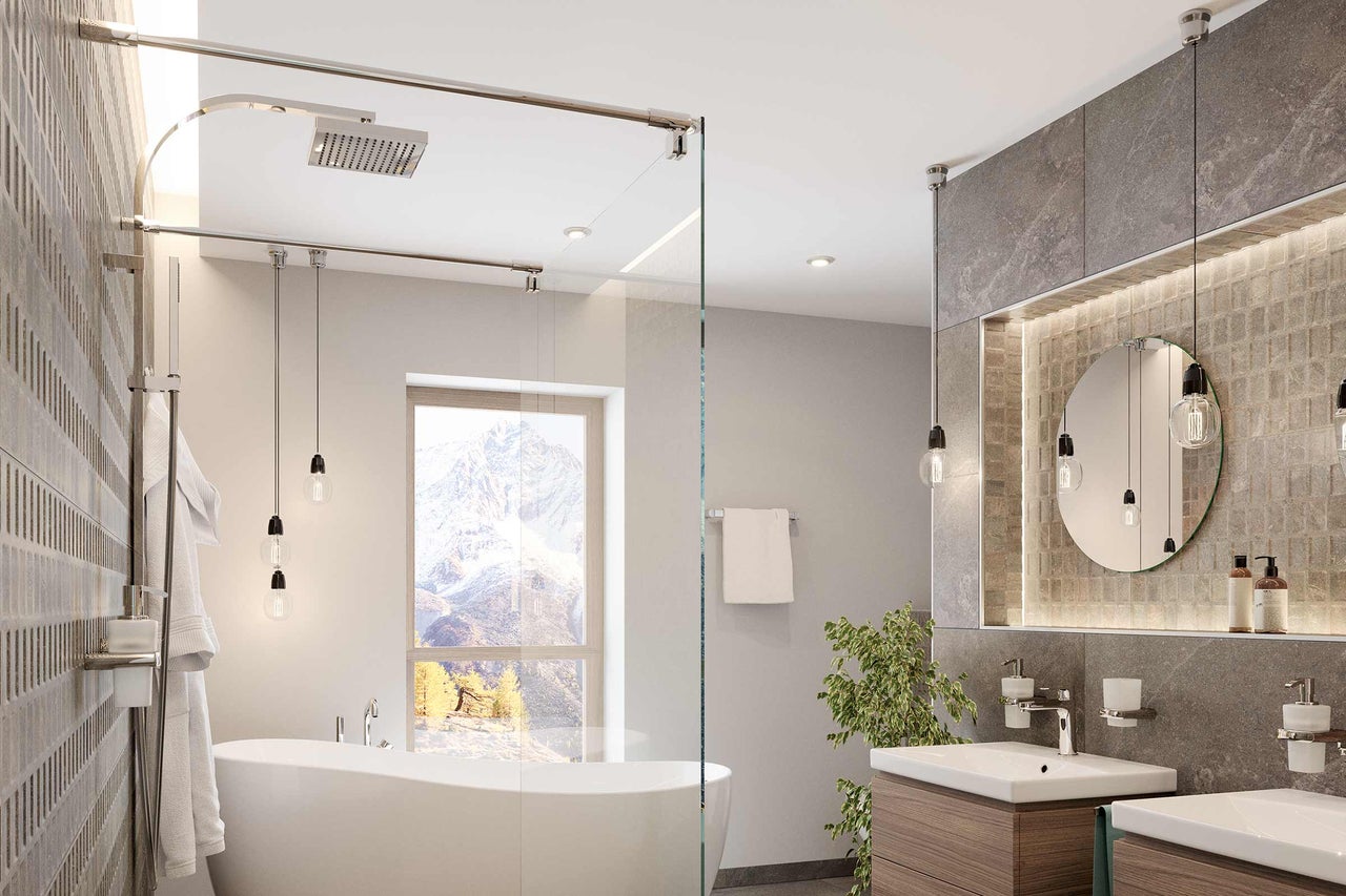 Modernes Badezimmer mit Badewanne, Dusche, Waschtisch und Beleuchtung