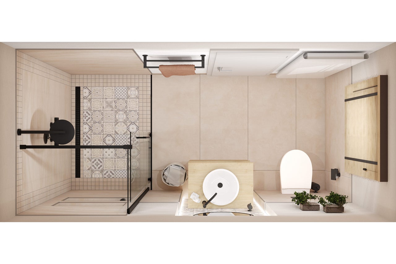 Vue d'ensemble d'une salle de bains avec douche, lavabo, toilettes et meubles de salle de bains.