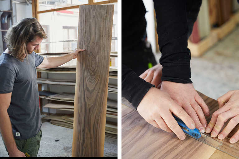 Deux artisans travaillent une feuille de placage avec un cutter et une règle.