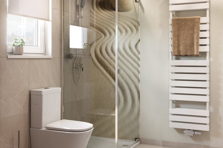 Salle de bains avec toilettes, douche à motif et radiateur avec serviette