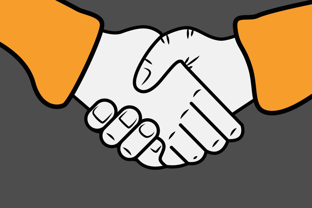 Image symbolique d'un accord par une poignée de main