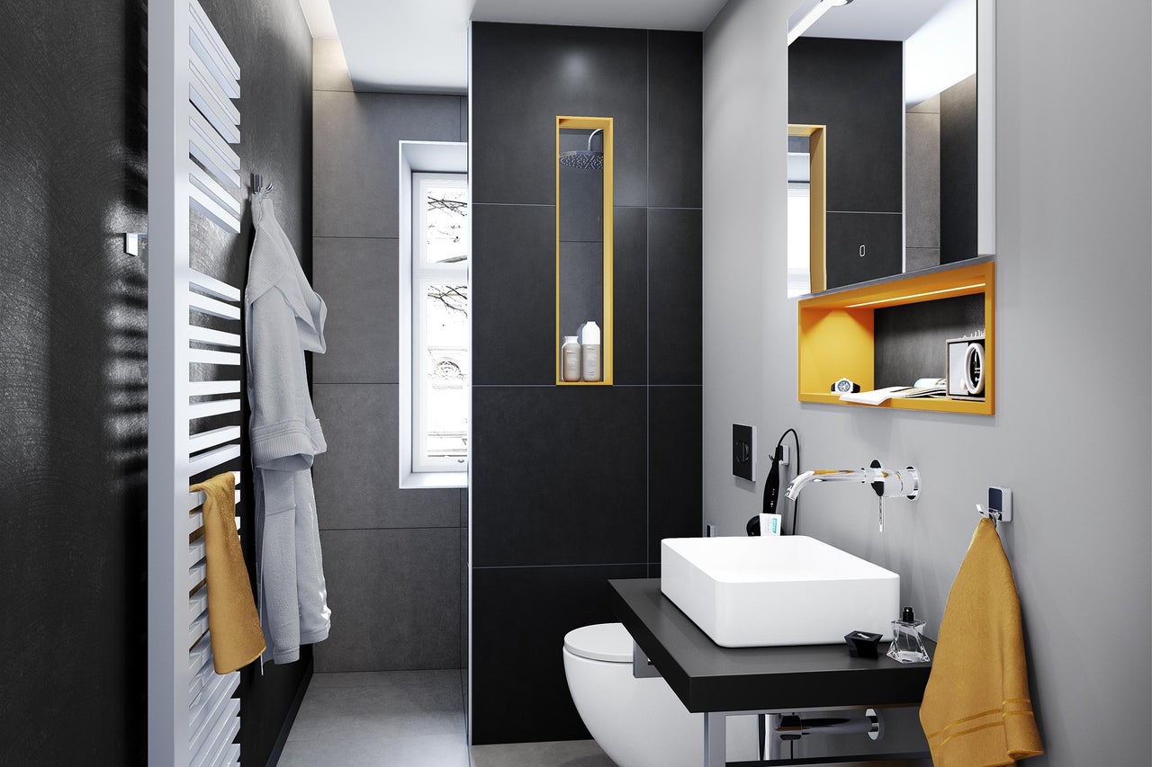 Salle de bains moderne avec lavabo, sèche-serviettes et carrelage foncé