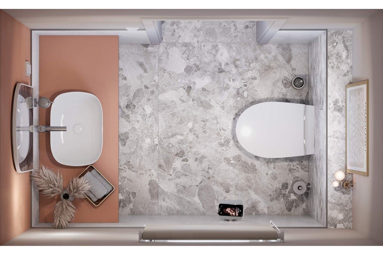 Vogelperspektive eines Badezimmers mit Waschbecken, Toilette und Fliesenboden