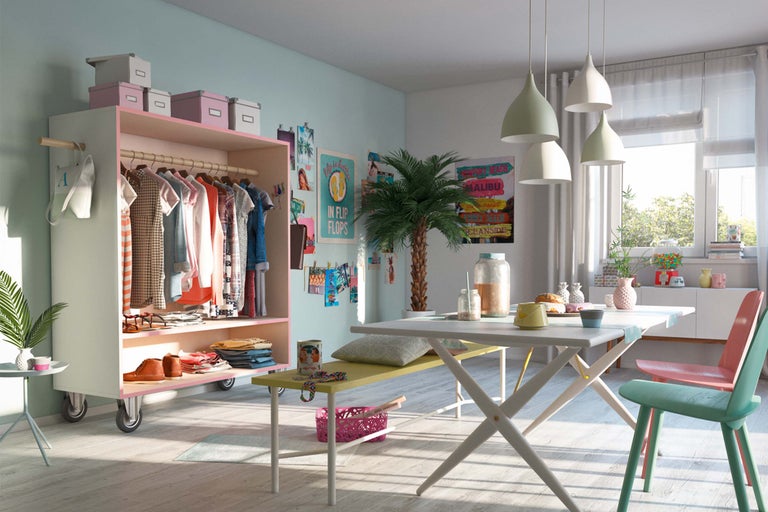 Espace de vie lumineux avec armoire, table et chaises de style scandinave