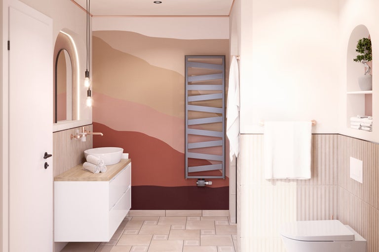 Salle de bain lumineuse avec meuble-lavabo, sèche-serviettes et décoration murale.
