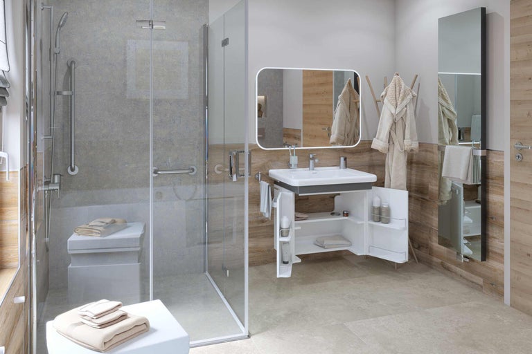 Salle de bain claire avec douche, meuble sous-lavabo, miroir et serviettes