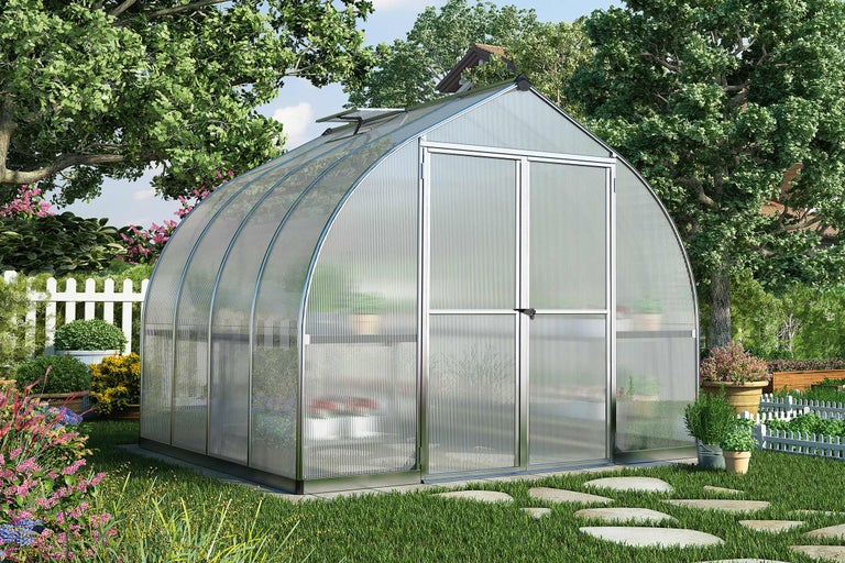 Serre dans un jardin avec des plantes et des fleurs