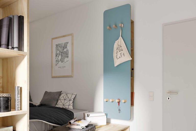 Chambre de jeune moderne avec étagère, lit et porte-manteau mural