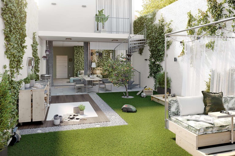 Jardin paysager avec pelouse, mobilier de jardin, bac à sable et plantations sur les murs