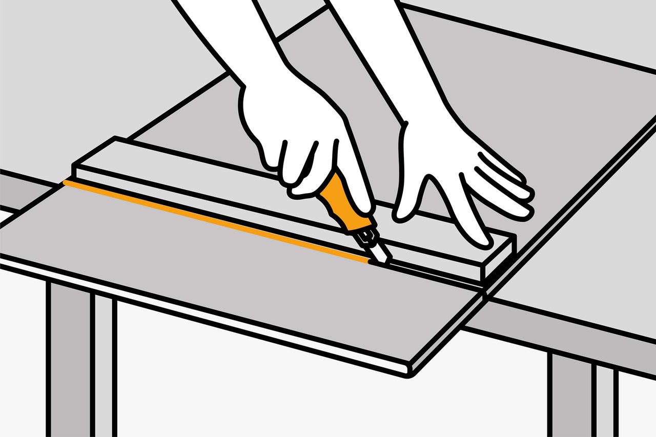 Illustration d'une personne coupant un matériau sur une table avec un cutter.