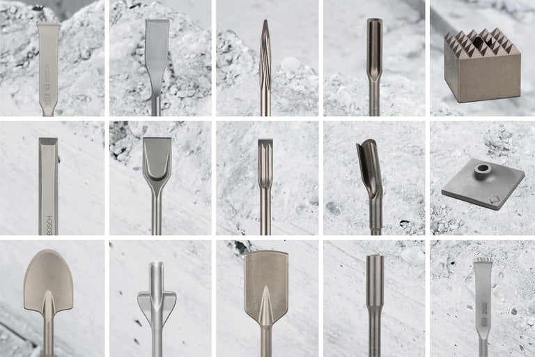 Un arrangement de différents accessoires de burin pour marteaux perforateurs.