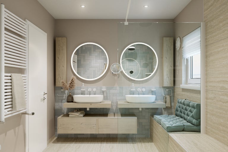 Salle de bain moderne avec lavabos, miroirs ronds avec éclairage, sèche-serviettes chauffant et banquette