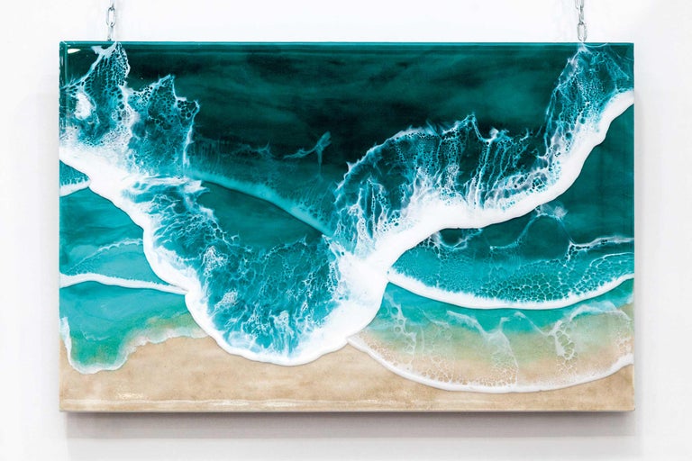 Peinture avec des vagues et une plage sur une chaîne