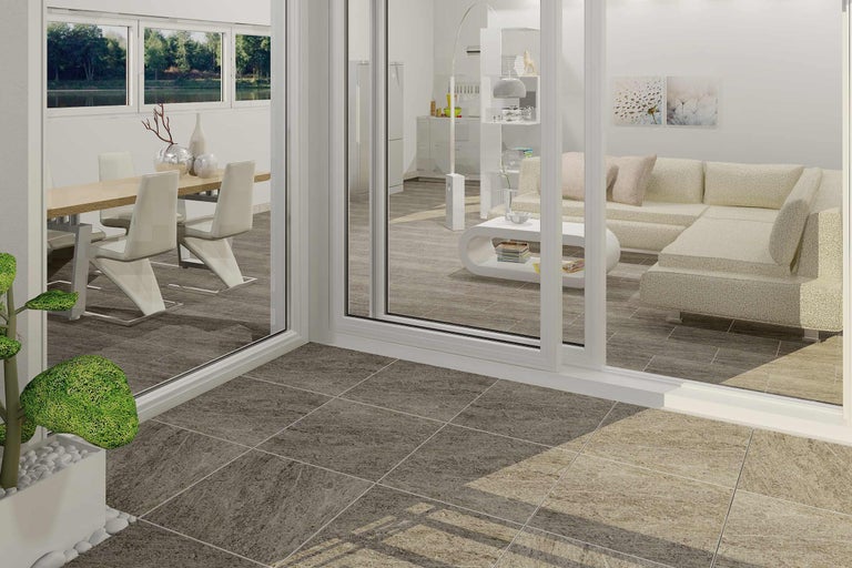 Salon lumineux avec table à manger, canapé et carrelage.