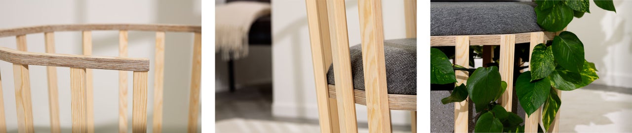 Detailansicht eines Holzstuhls mit grauer Sitzfläche und Sprossenlehne