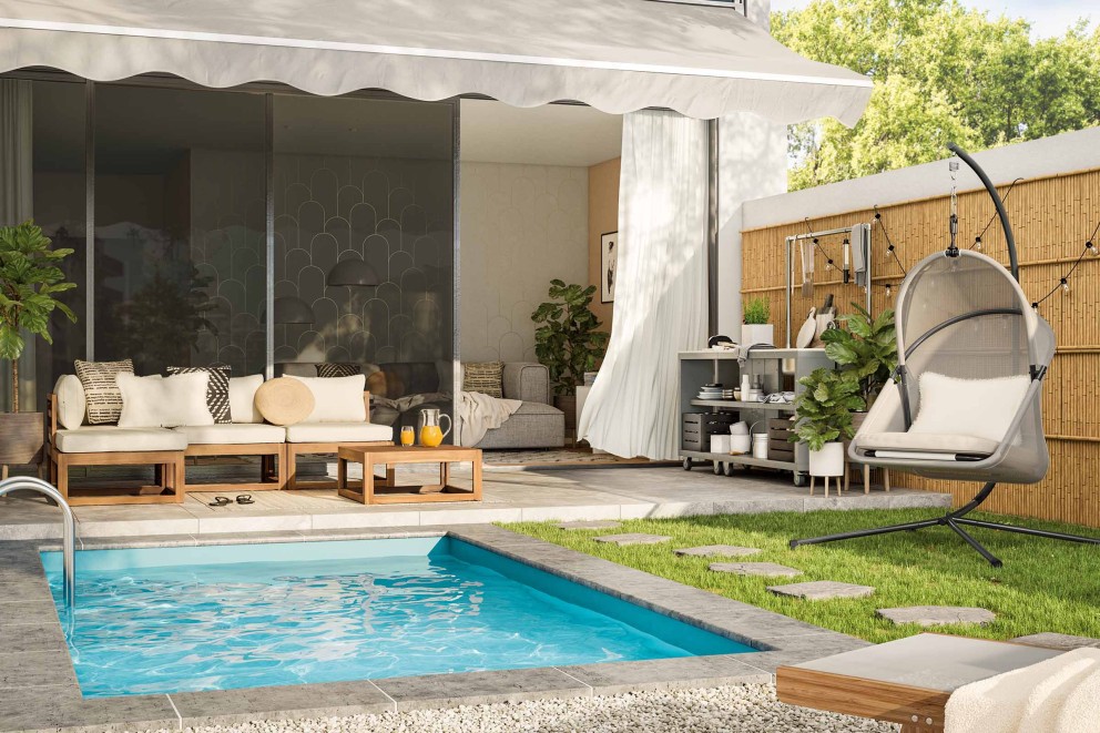  Un espace jardin avec piscine, chaise hamac et coin salon du monde de l'habitat Inside Out 