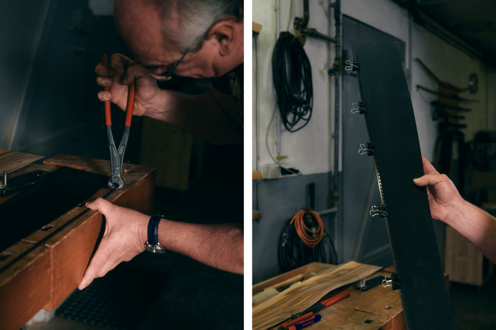 Werkstattsituation mit Handwerker bei der Bearbeitung eines Werkstücks mit einer Zange.
