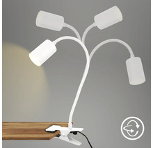 Klemmleuchte mit vier Armen und verstellbaren Leuchtenköpfen an einem Tisch befestigt