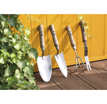 Set d''outils de jardin composé d''une plantoir, d''un transplantoir, d''une binette et d''une fourche à main sur fond jaune