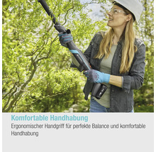 Femme avec lunettes de protection et casque coupant des arbres avec un taille-haie sans fil de Gardena